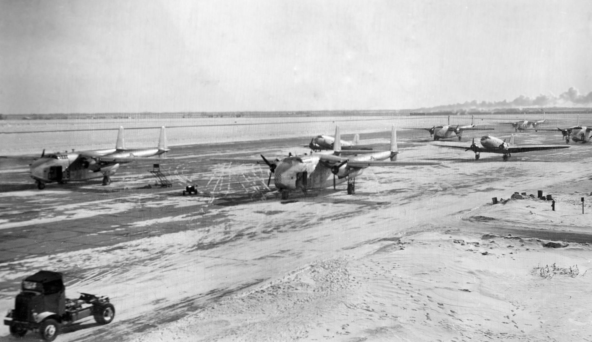 Planes line up at the Kearney airport for Operation Haylift, in which tons of hay were dropped on farms in the blizzard stricken area north and west of Kearney. Published in February 1949.